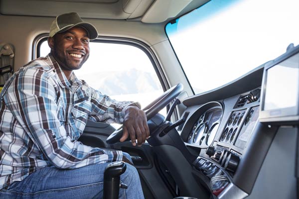 truck driver smiling in cab